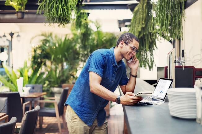 Man checking tablet restaurant